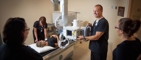 Teacher and students in the radiology department.