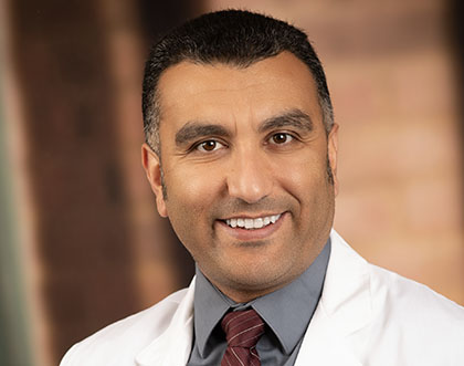 Portrait of Tariq Enezate, MD.